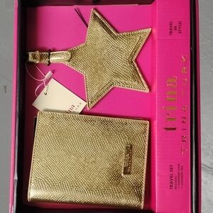 Trina Turk gold star luggage tags and gold passport case